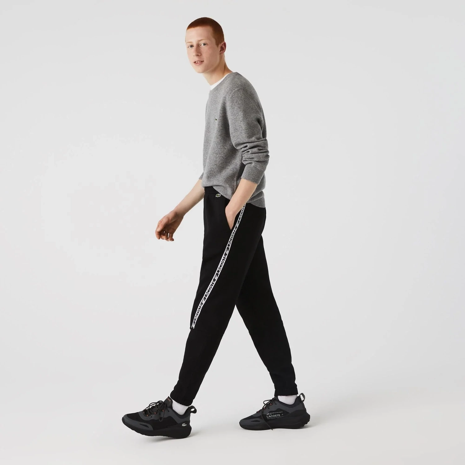 Lacoste XH9888 52 031 Black Joggers For Men with white logo band across it