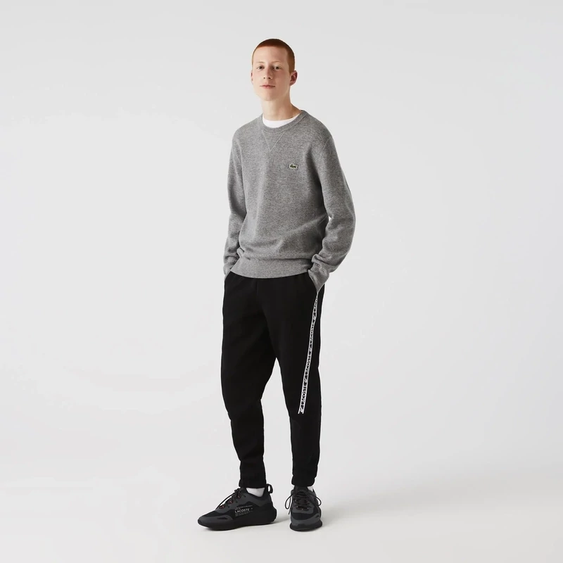 Lacoste XH9888 52 031 Black Joggers For Men with white logo band across it