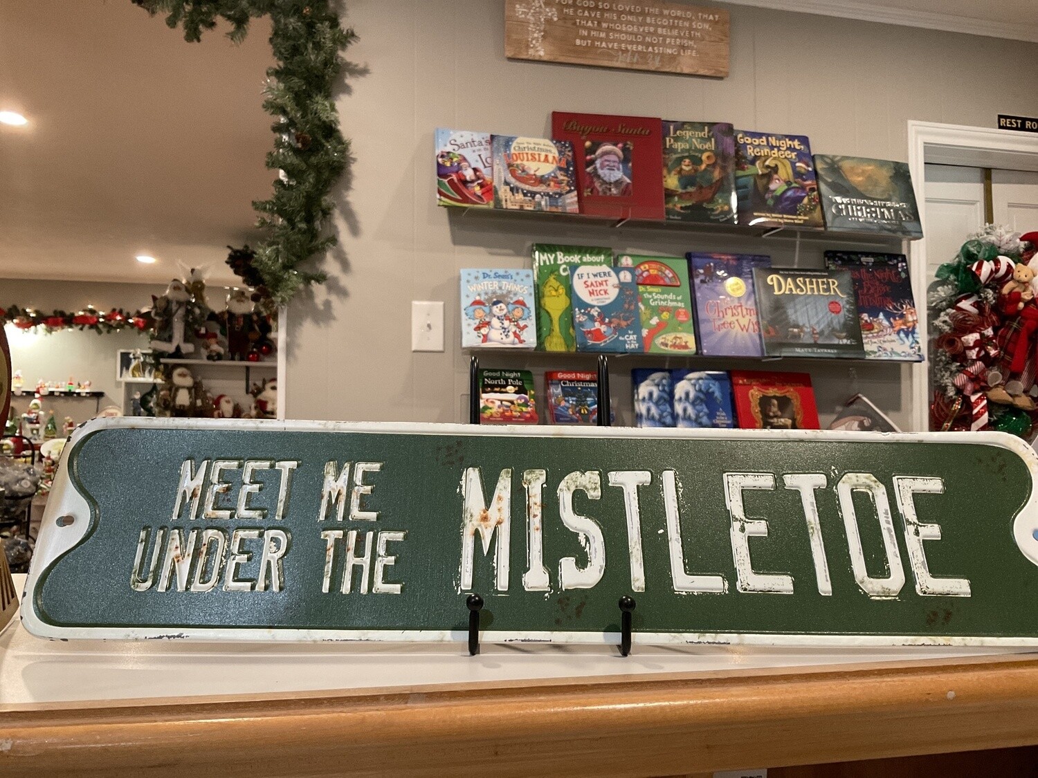 Under the mistletoe street sign