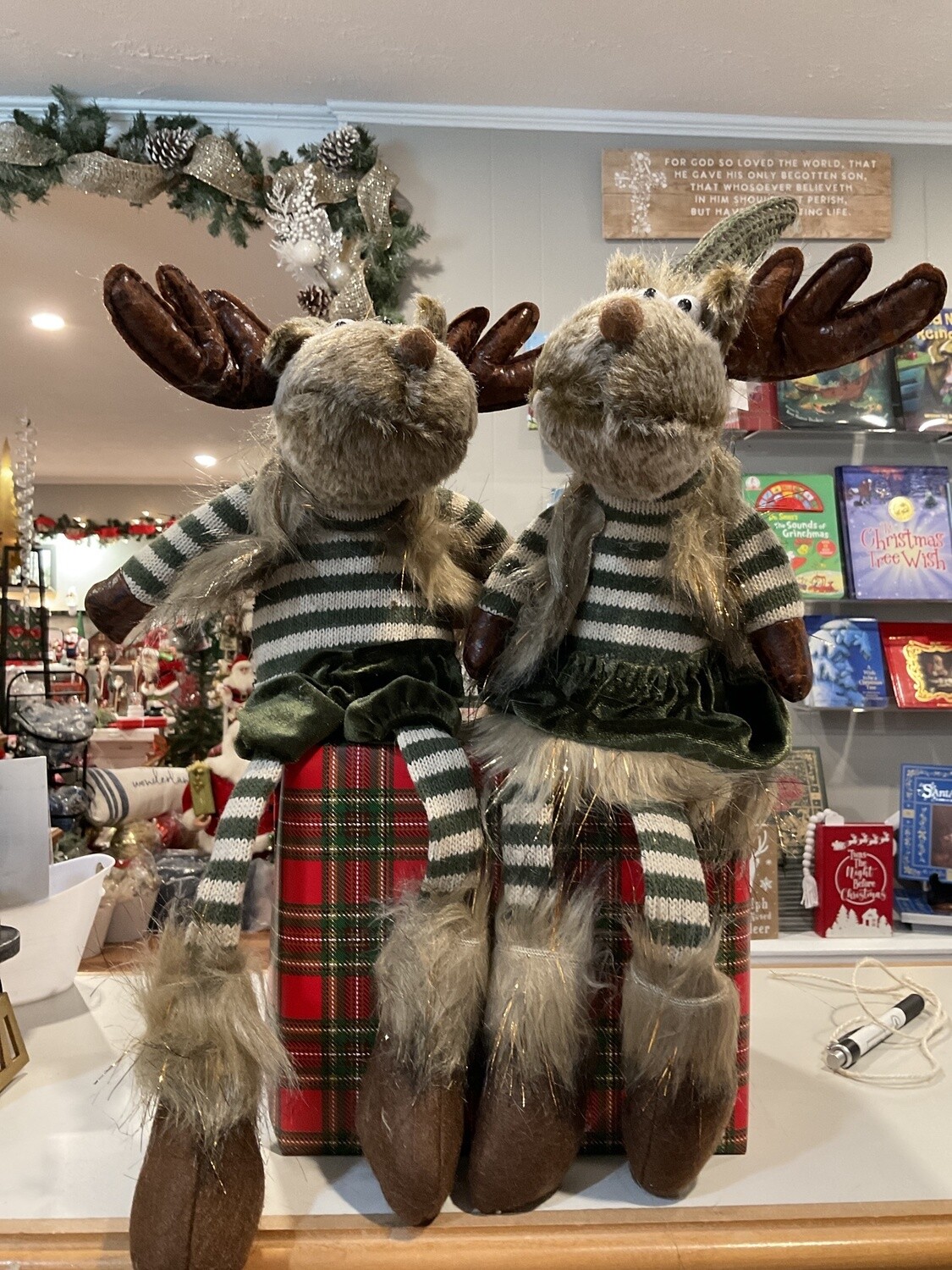 Mr. or Mrs. Green reindeer with dangling legs