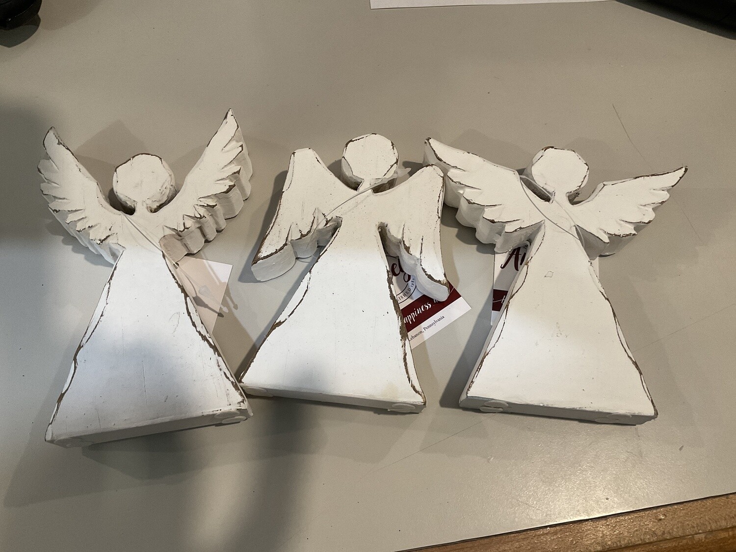 Distressed, angel figures