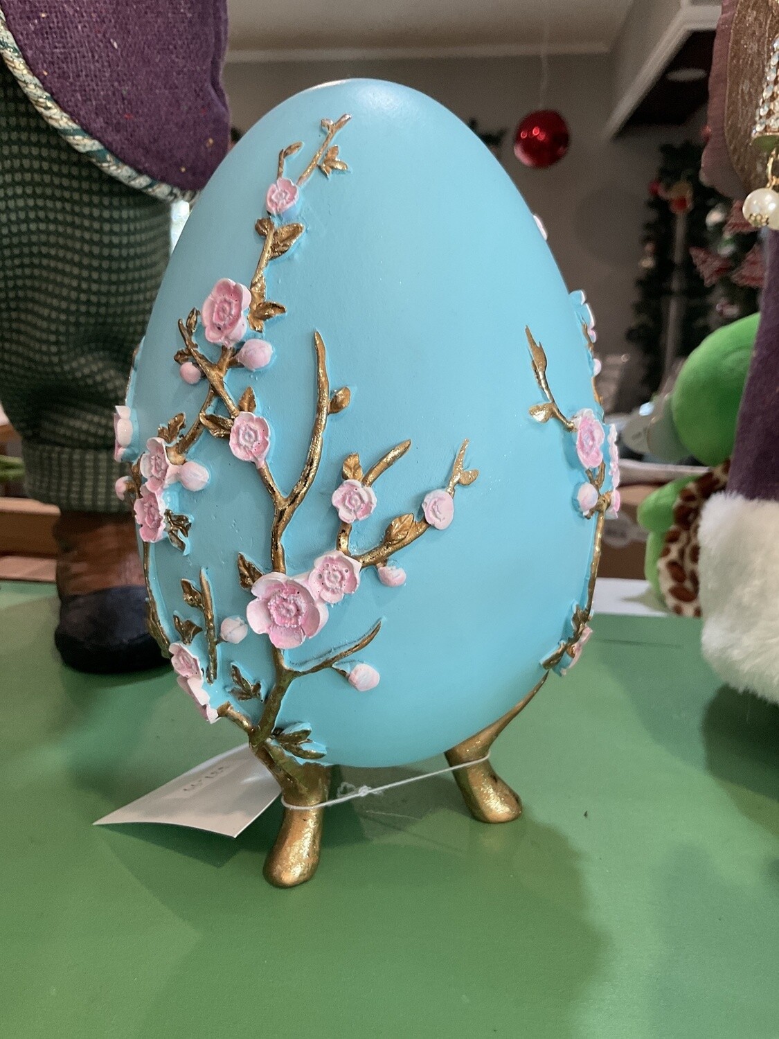 Teal egg with pink flowers