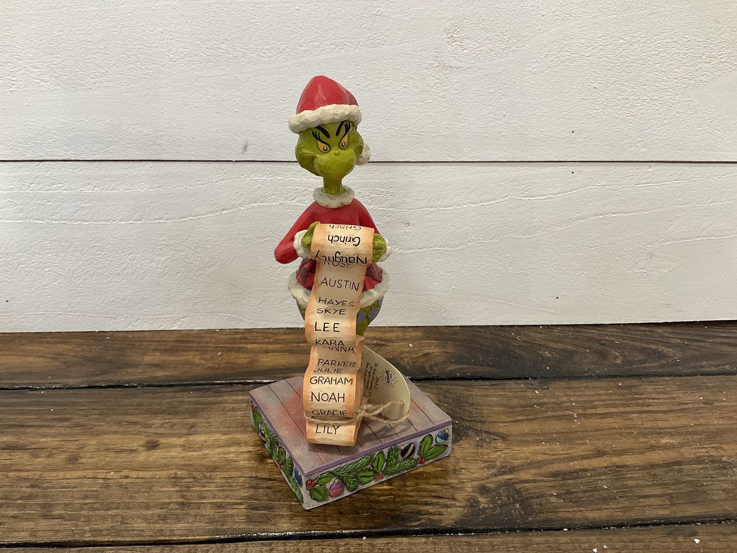 Grinch holding naughty list