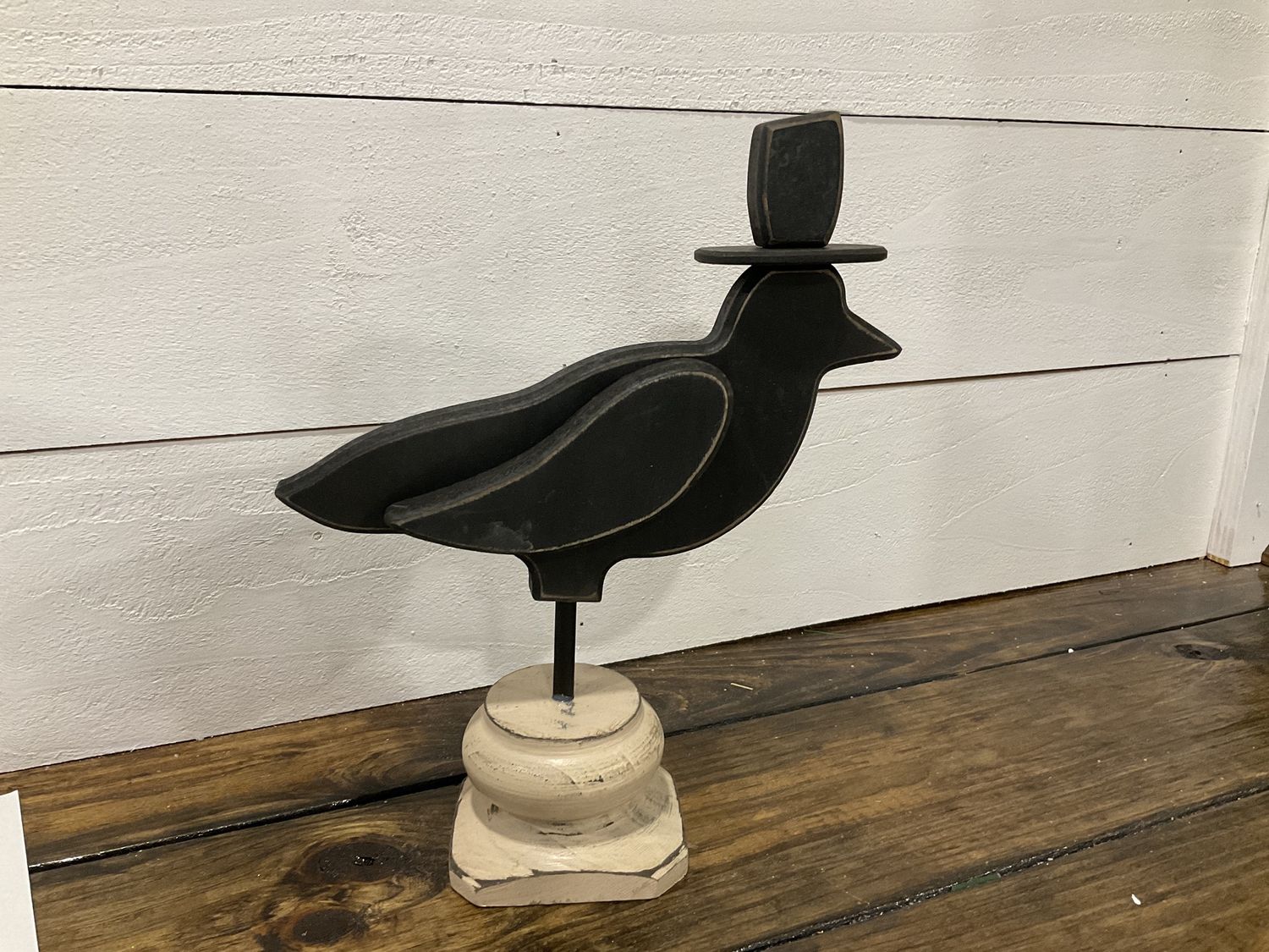 Wooden crow with top hat