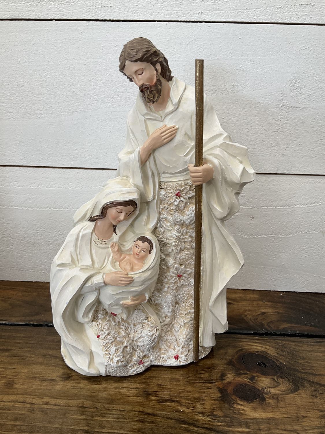 Holy family poinsettia figure