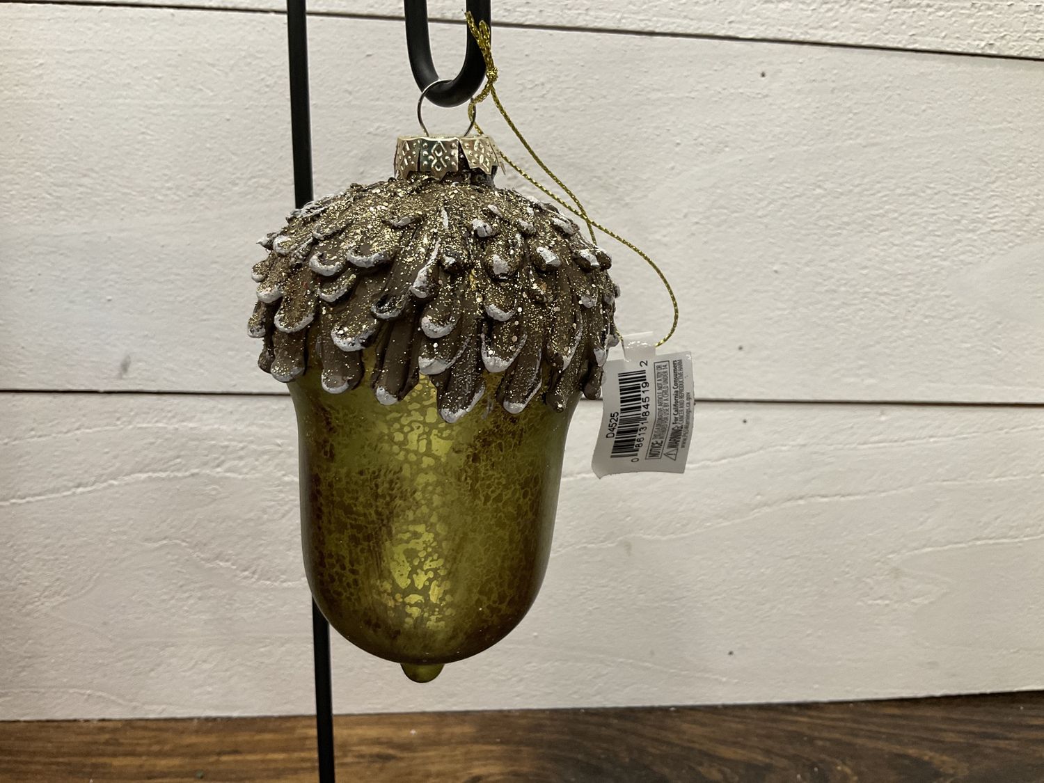 Antique gold and green glass acorn ornament