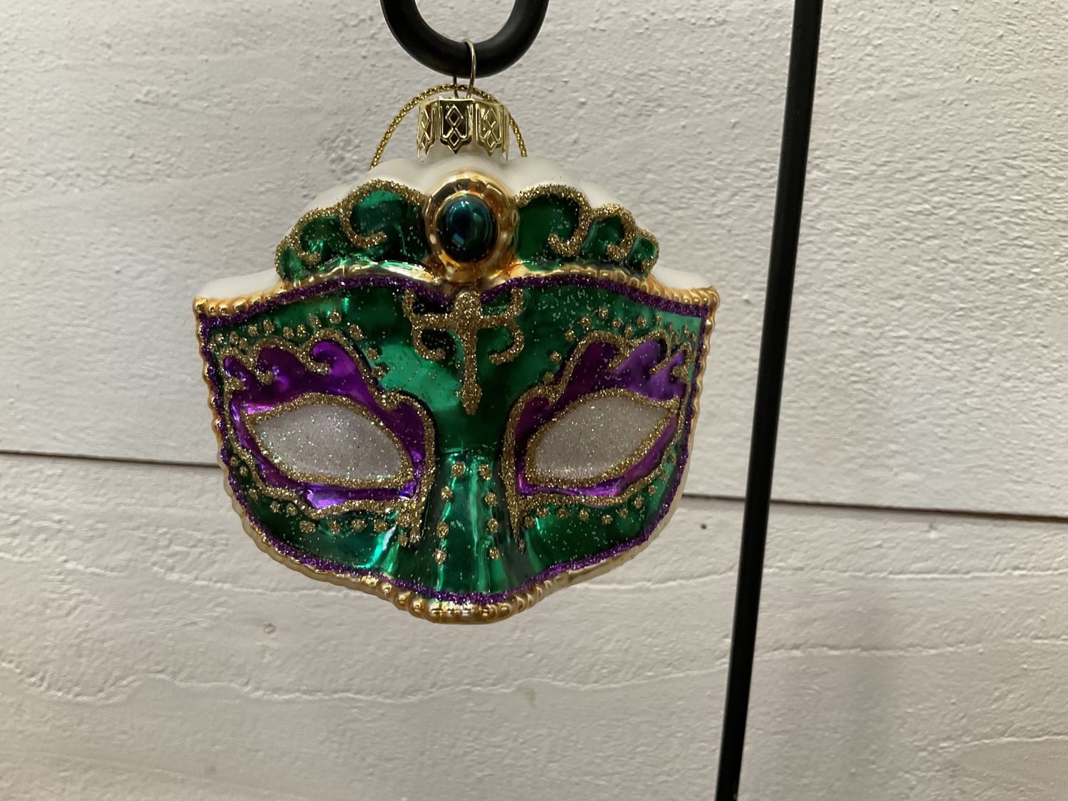 Purple and green Mardi Gras mask