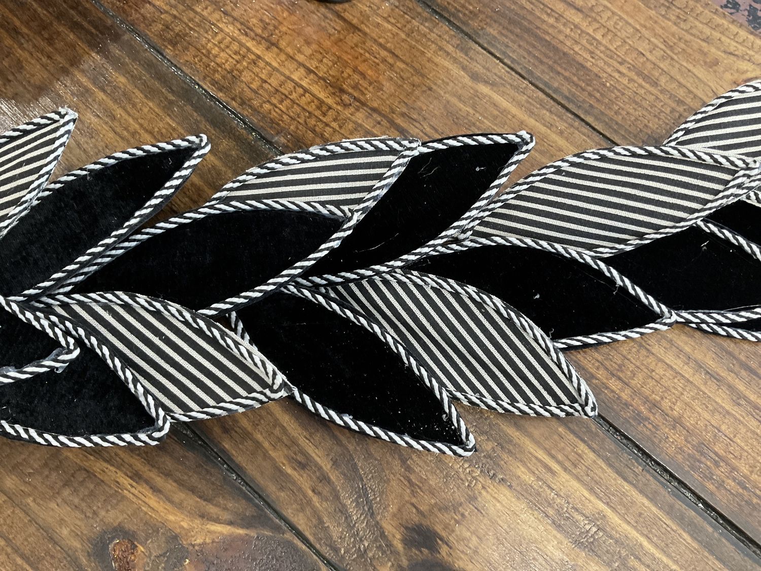 Wired fabric and felt leaf garland black-and-white