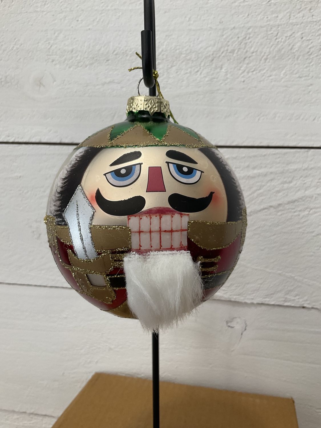 Glass round nutcracker face ornament