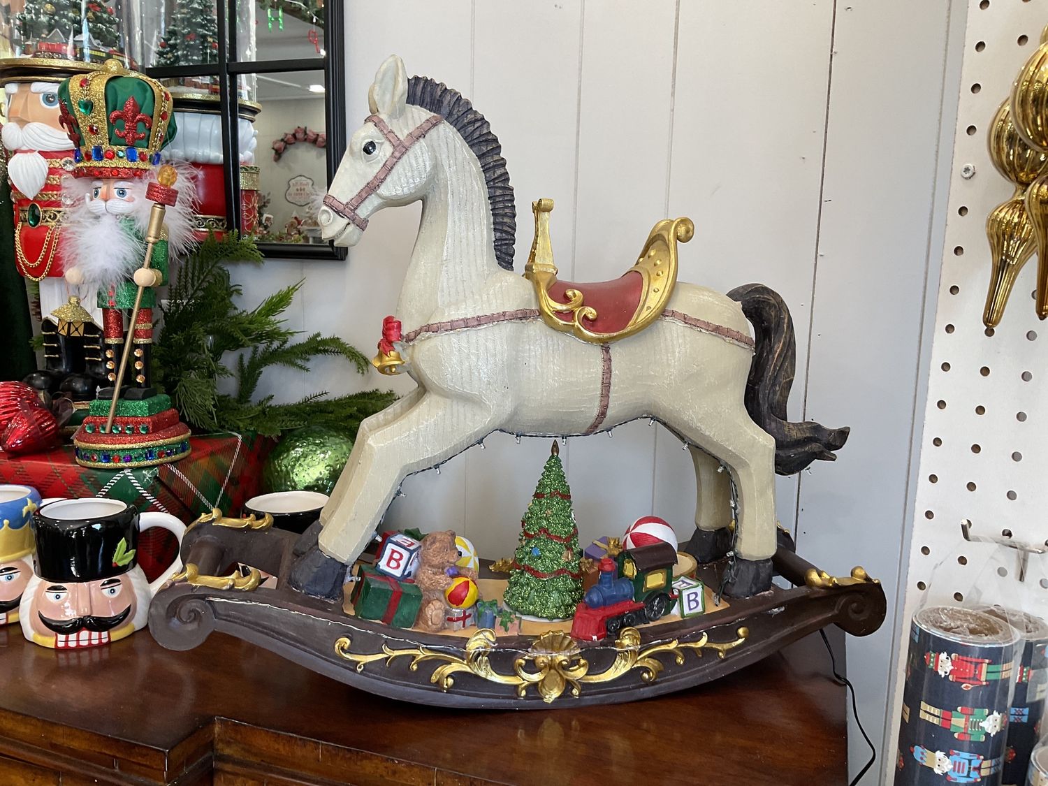 Electric lighted, musical, rocking horse
