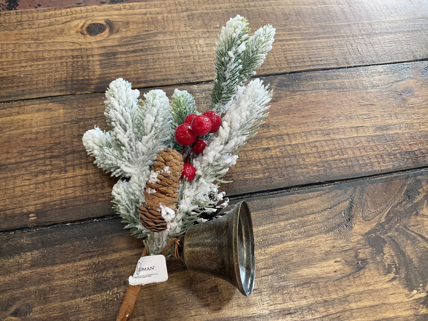 14 inch snow covered pic with bell