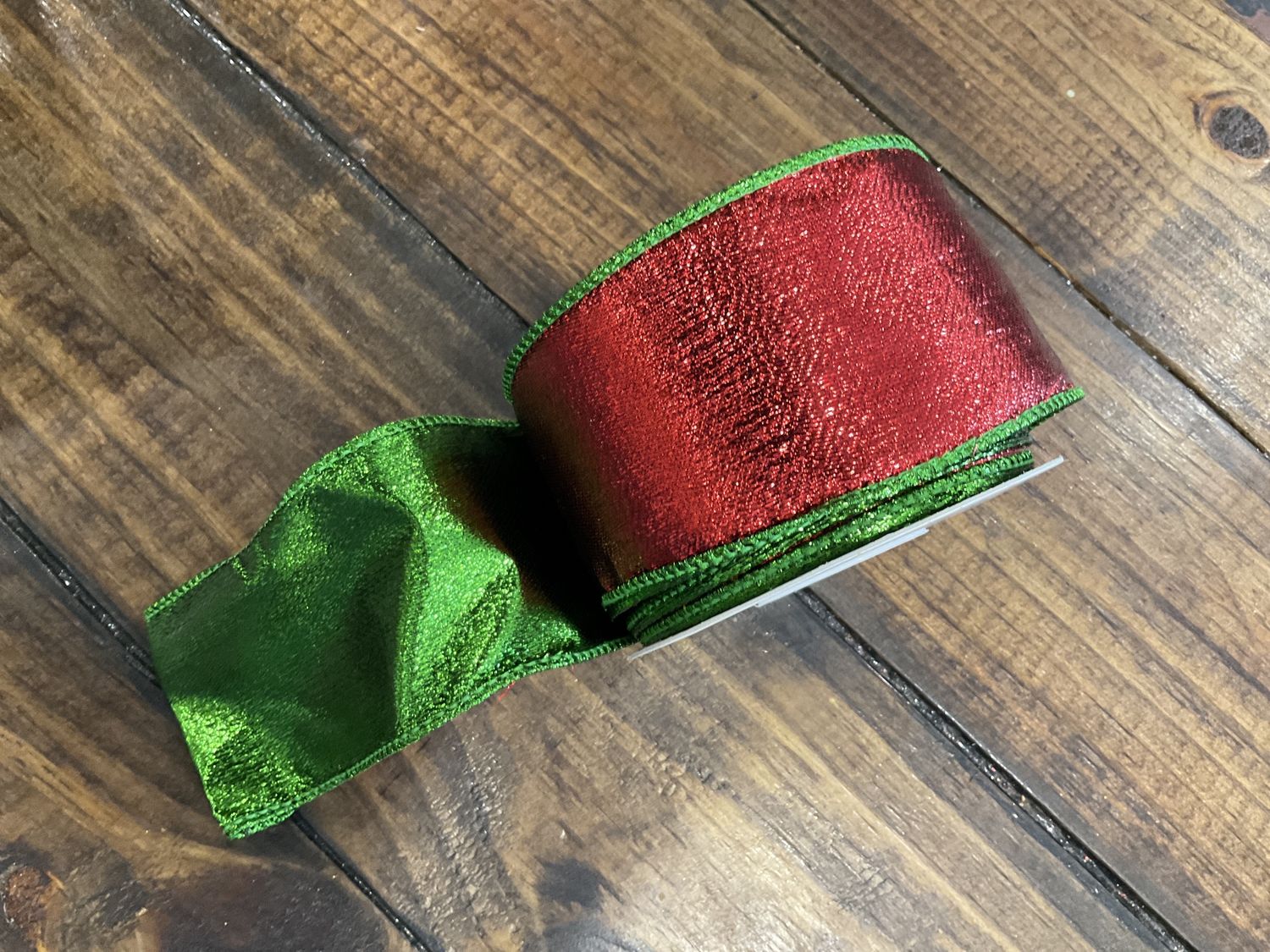 Red metallic ribbon with Emerald metallic edge and backing 2 1/2” x 10 yards