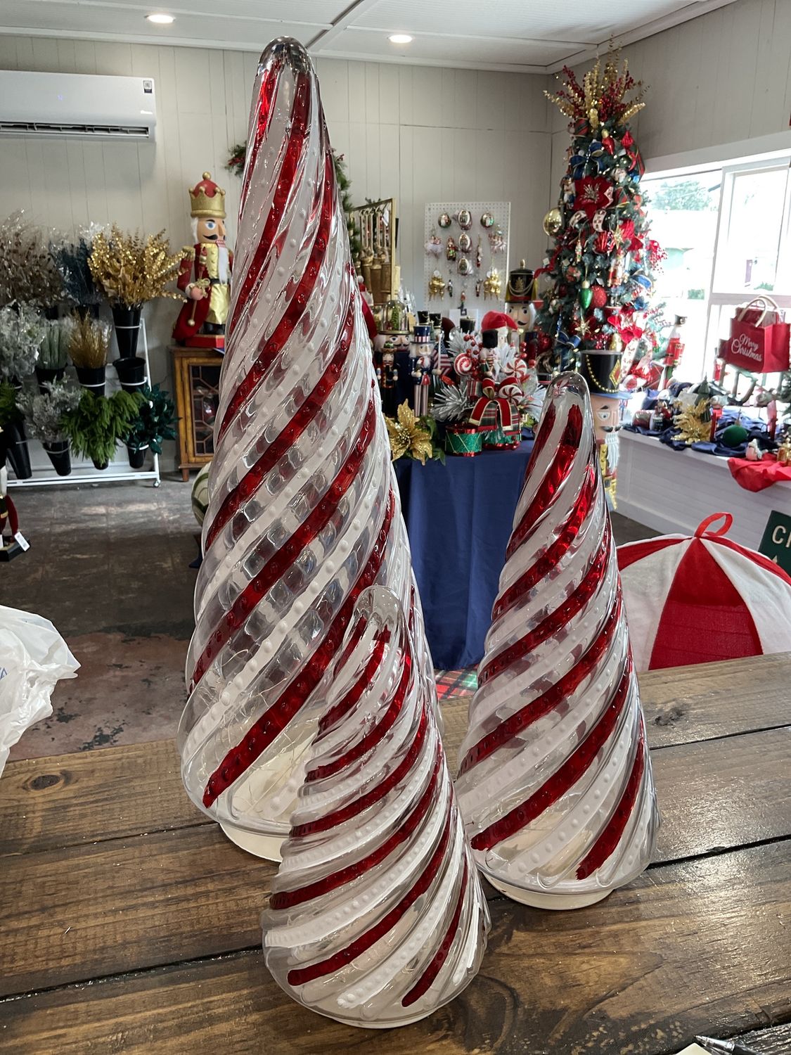 Set of three battery operated lighted swirl, glass Christmas trees