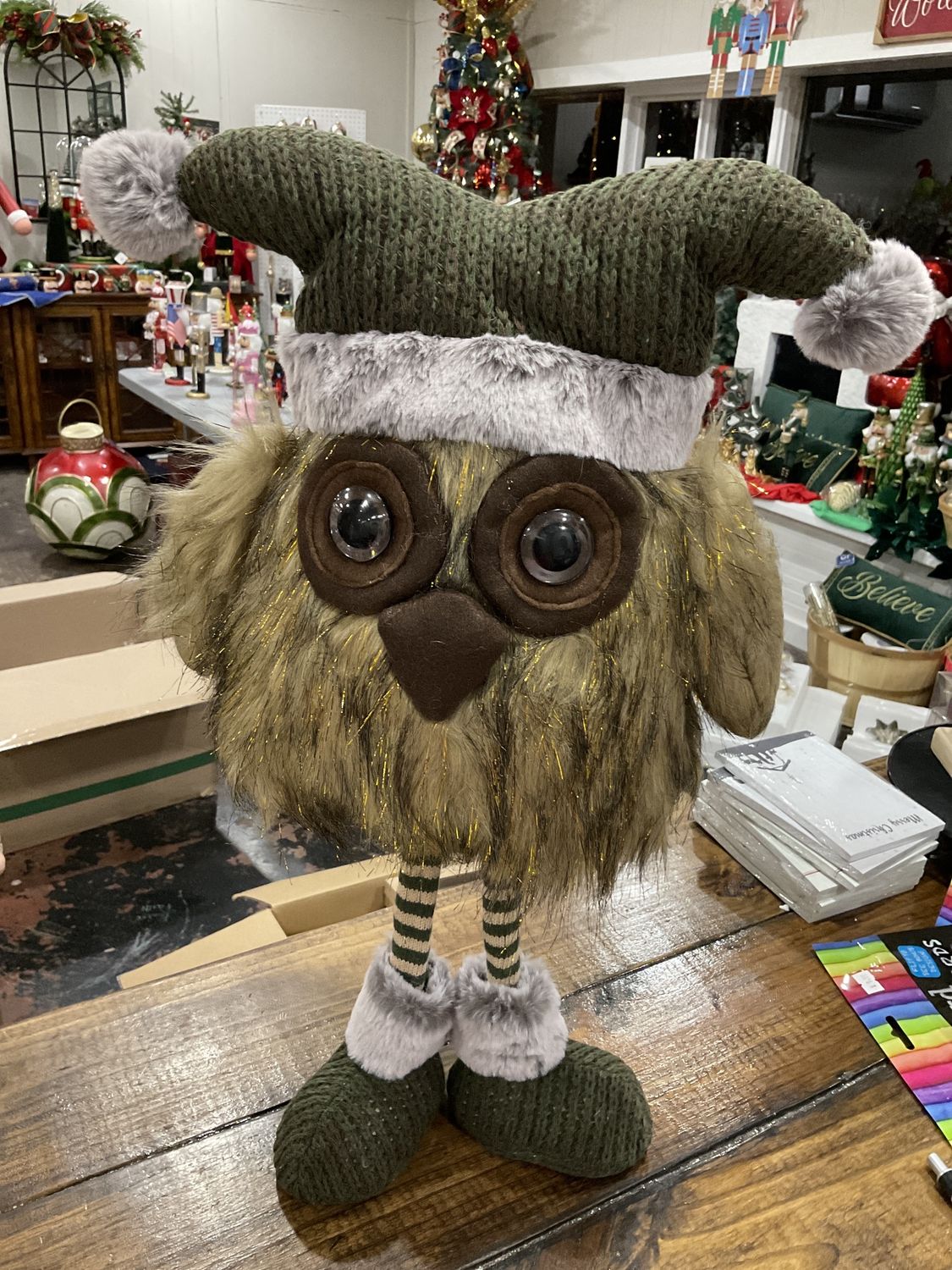 Standing fur owl with green knit hat