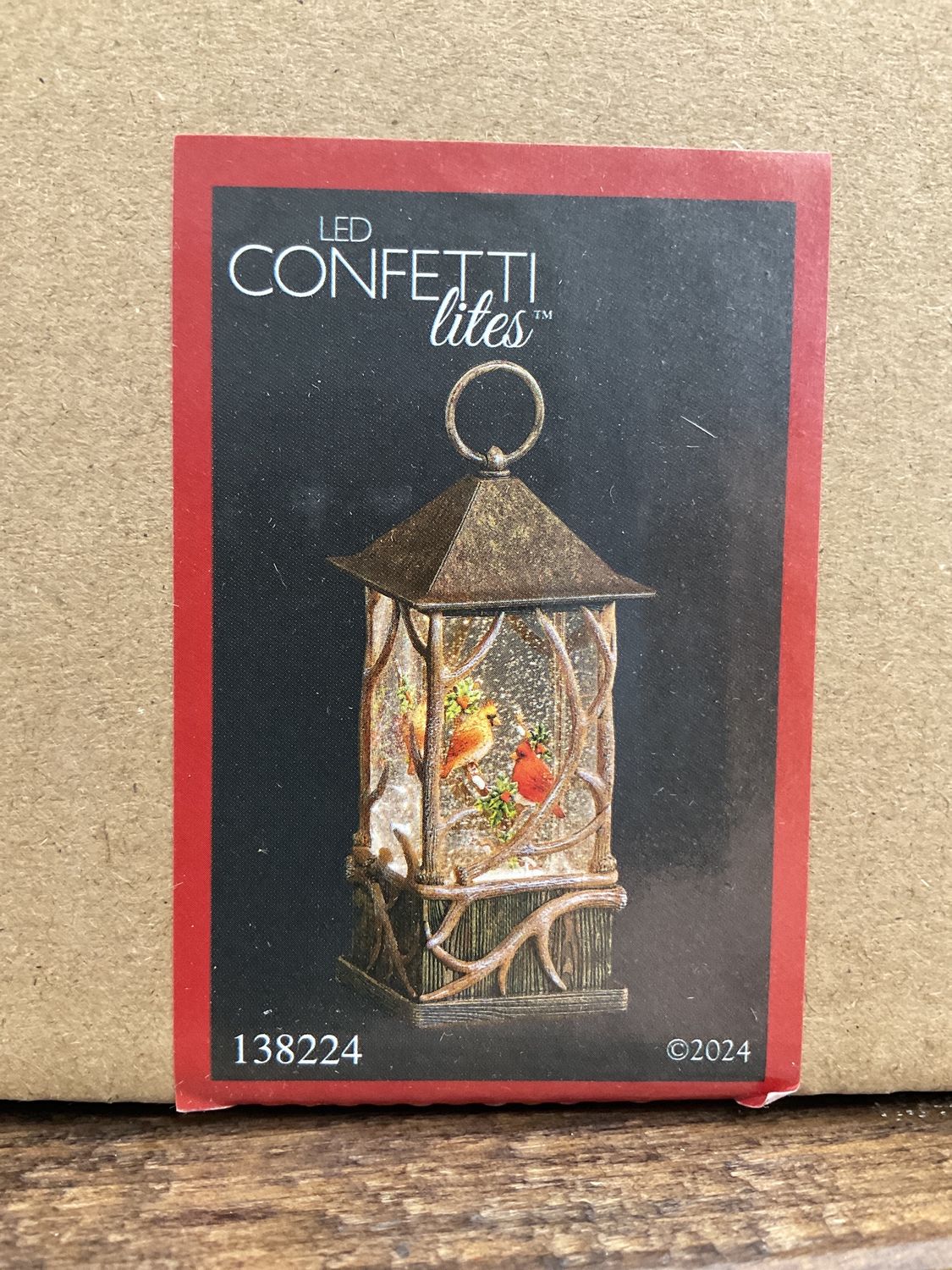 Lighted swirl Cardinal antler lantern