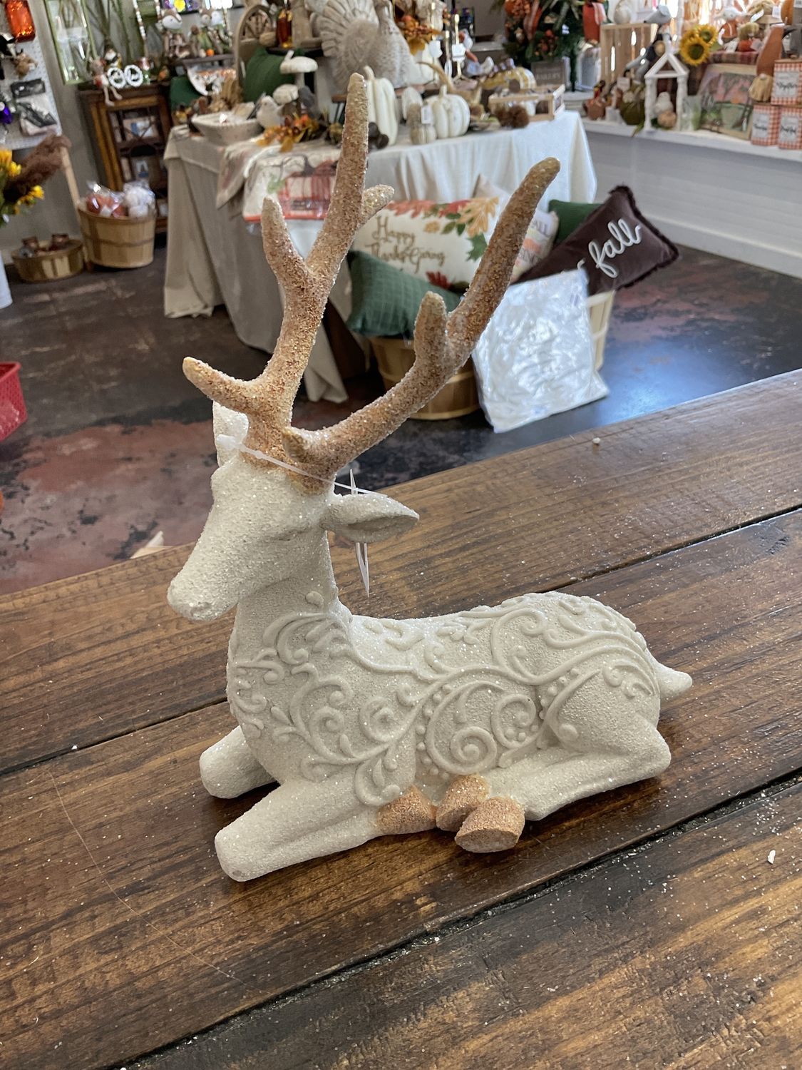 Laying down reindeer with glitter