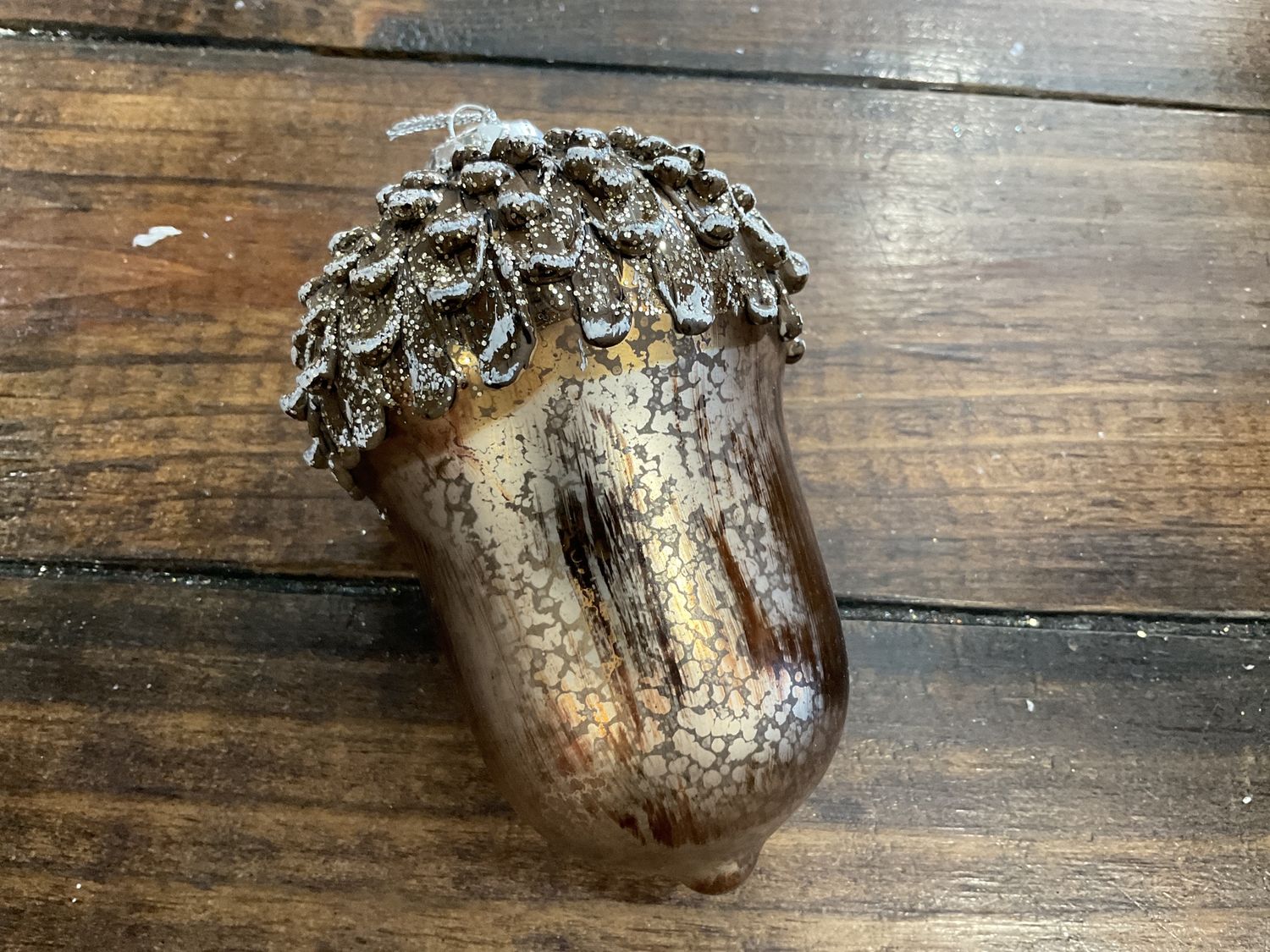 Antique gold and green glass acorn ornament