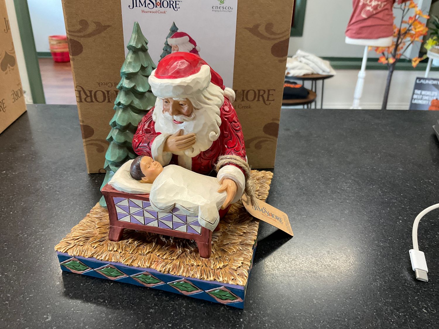 Jim Shore Santa kneeling over child