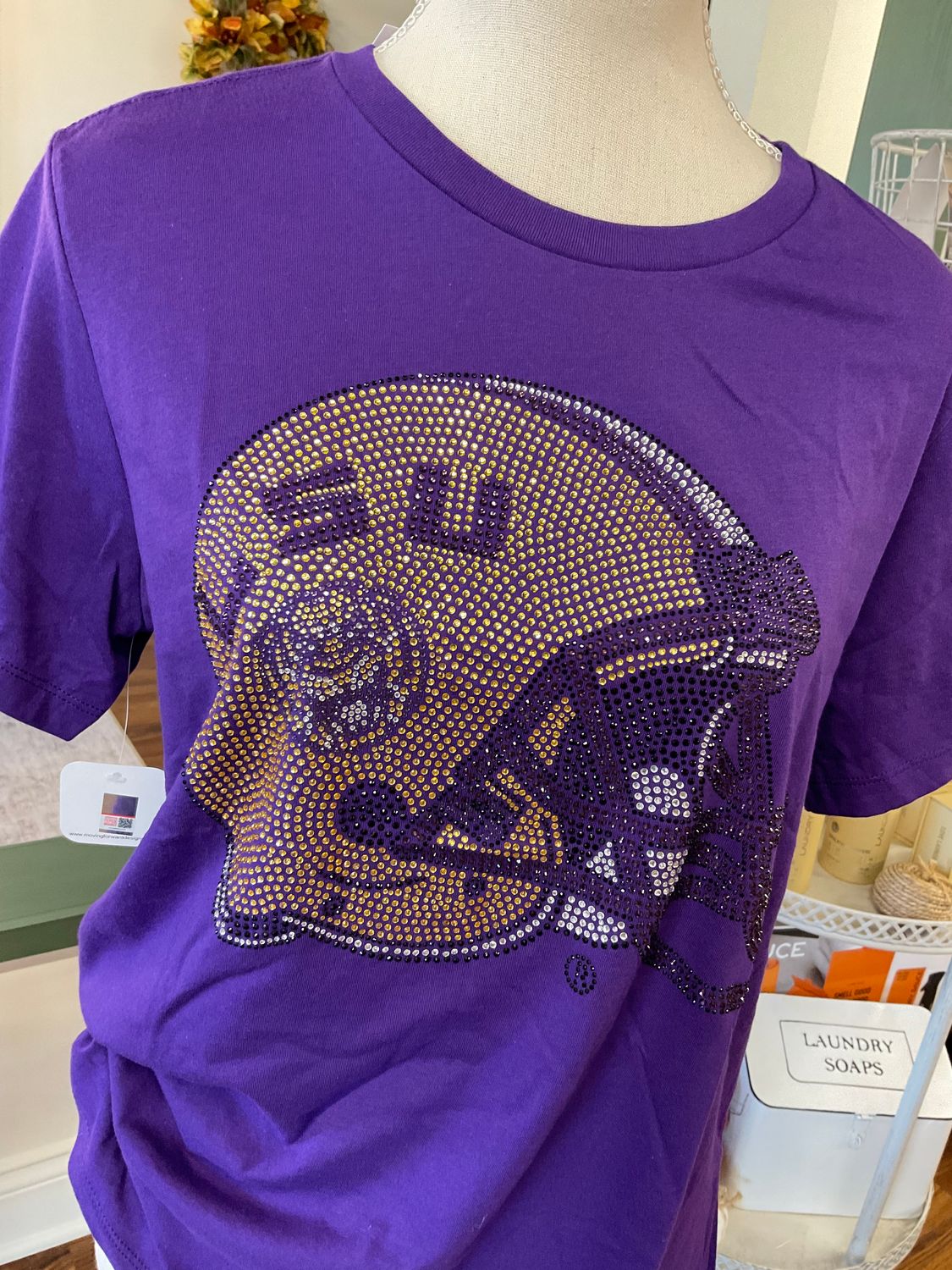 LSU helmet, purple crewneck T-shirt