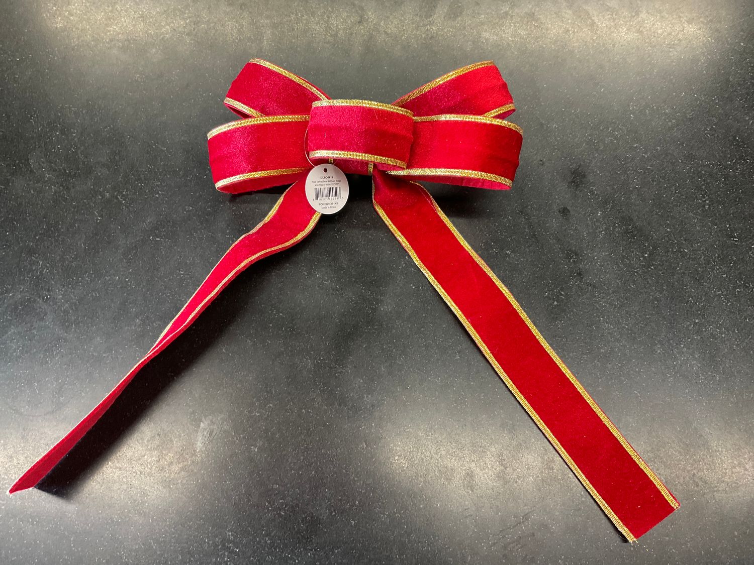 Red velvet bow with gold edge
