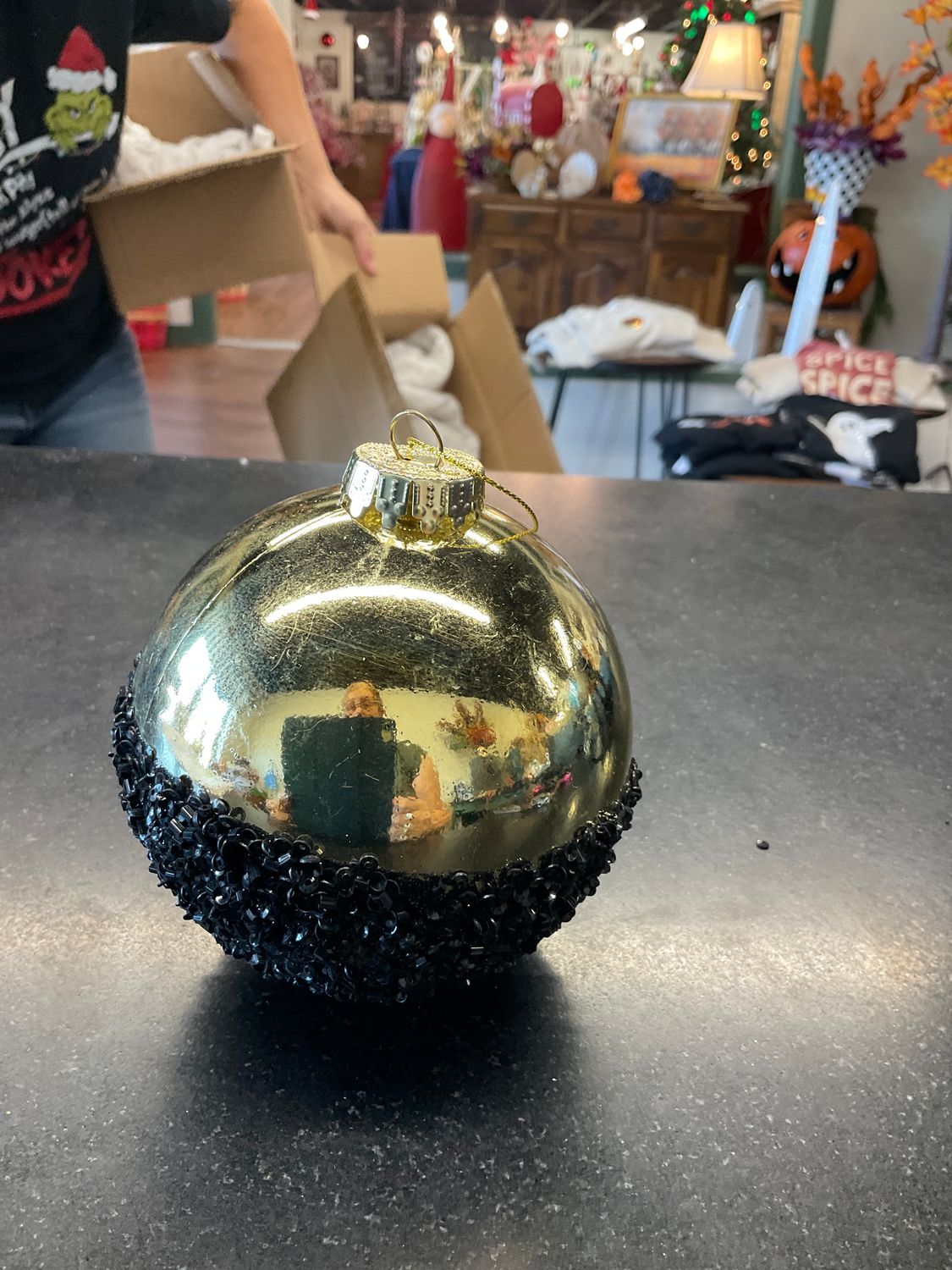 Black and gold half the fun Christmas ball