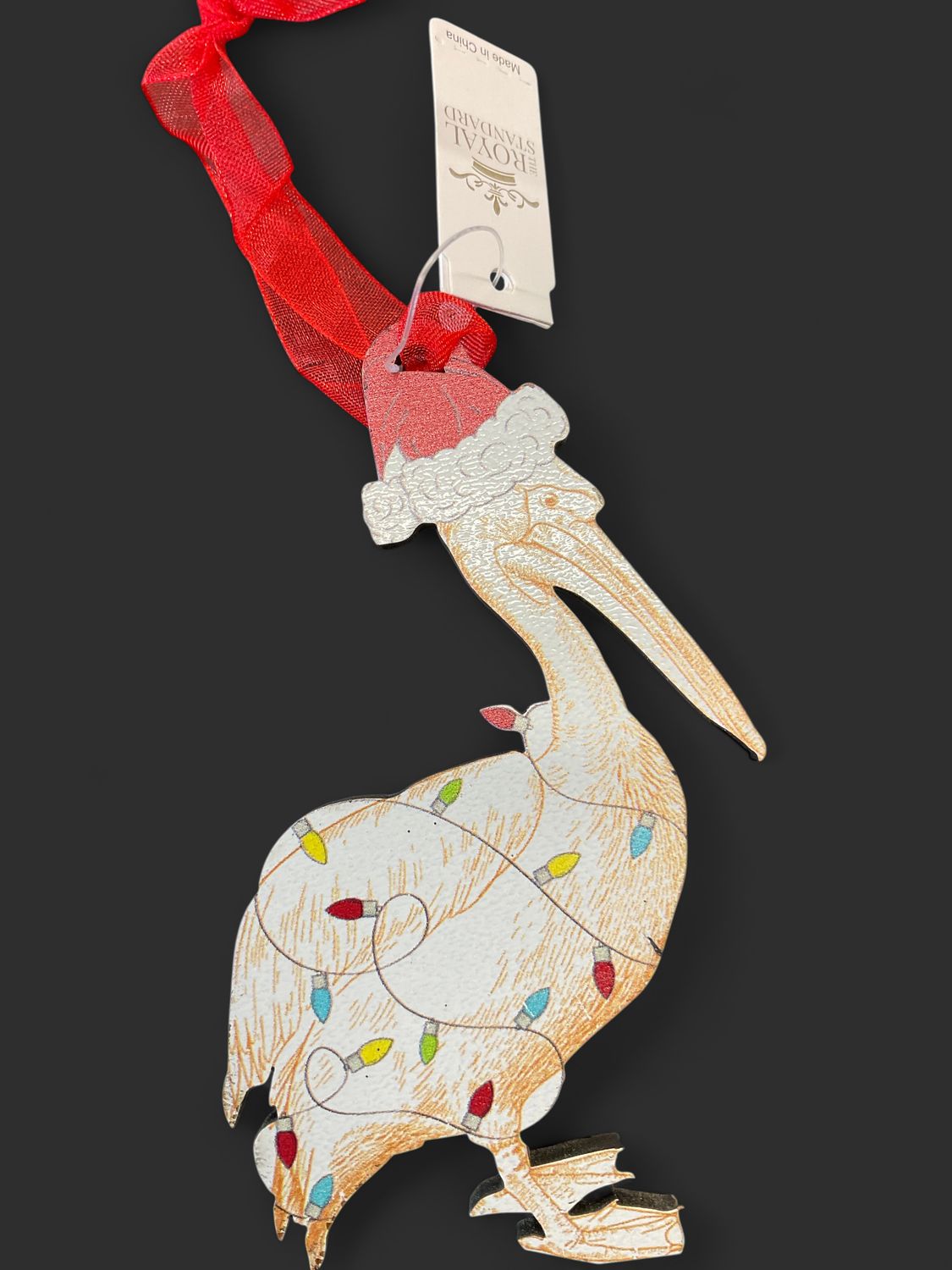 Festive pelican wood ornament