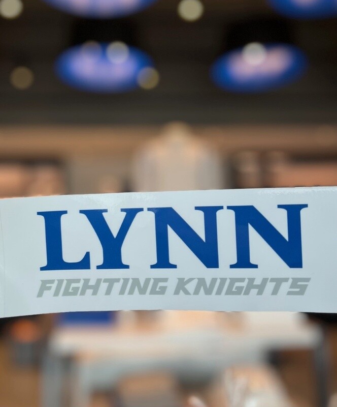 White decal with royal blue lettering saying &quot;Lynn&quot; and gray lettering underneath saying &quot;fighting knights.&quot;
