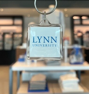 Clear key ring with white interior and blue text saying &quot;Lynn University.&quot;