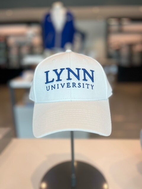 Choice between white and royal blue hat, the white hat has royal blue lettering saying &quot;Lynn University&quot; and the royal blue hat having white lettering saying the same thing.