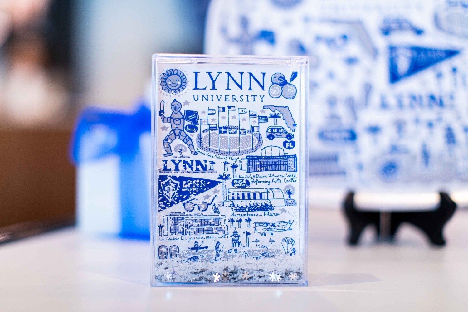 frosted clear frame with blue Lynn logos all over the front and blue text saying &quot;Lynn University.&quot;