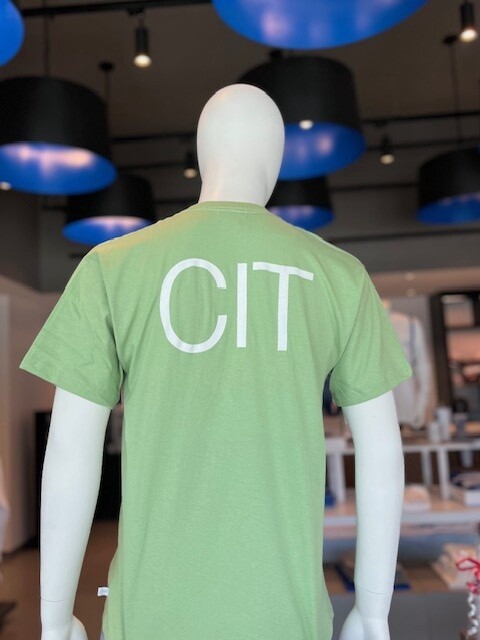 green short-sleeve t-shirt with white and royal blue text on the front saying &quot;Pine tree camps Lynn University,&quot; and white text on the back saying &quot;CIT&quot;.
