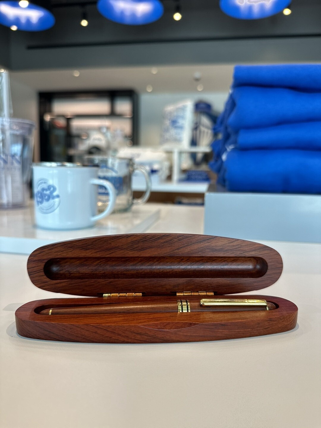 wooden box with golden pen.