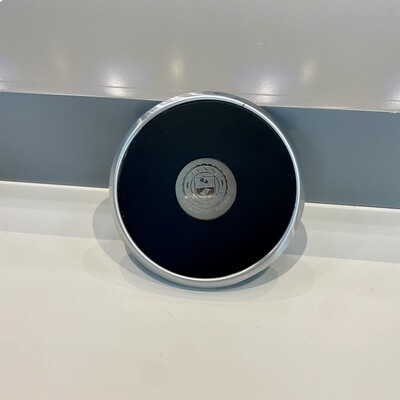 silver and black seal coaster with seal logo on front.