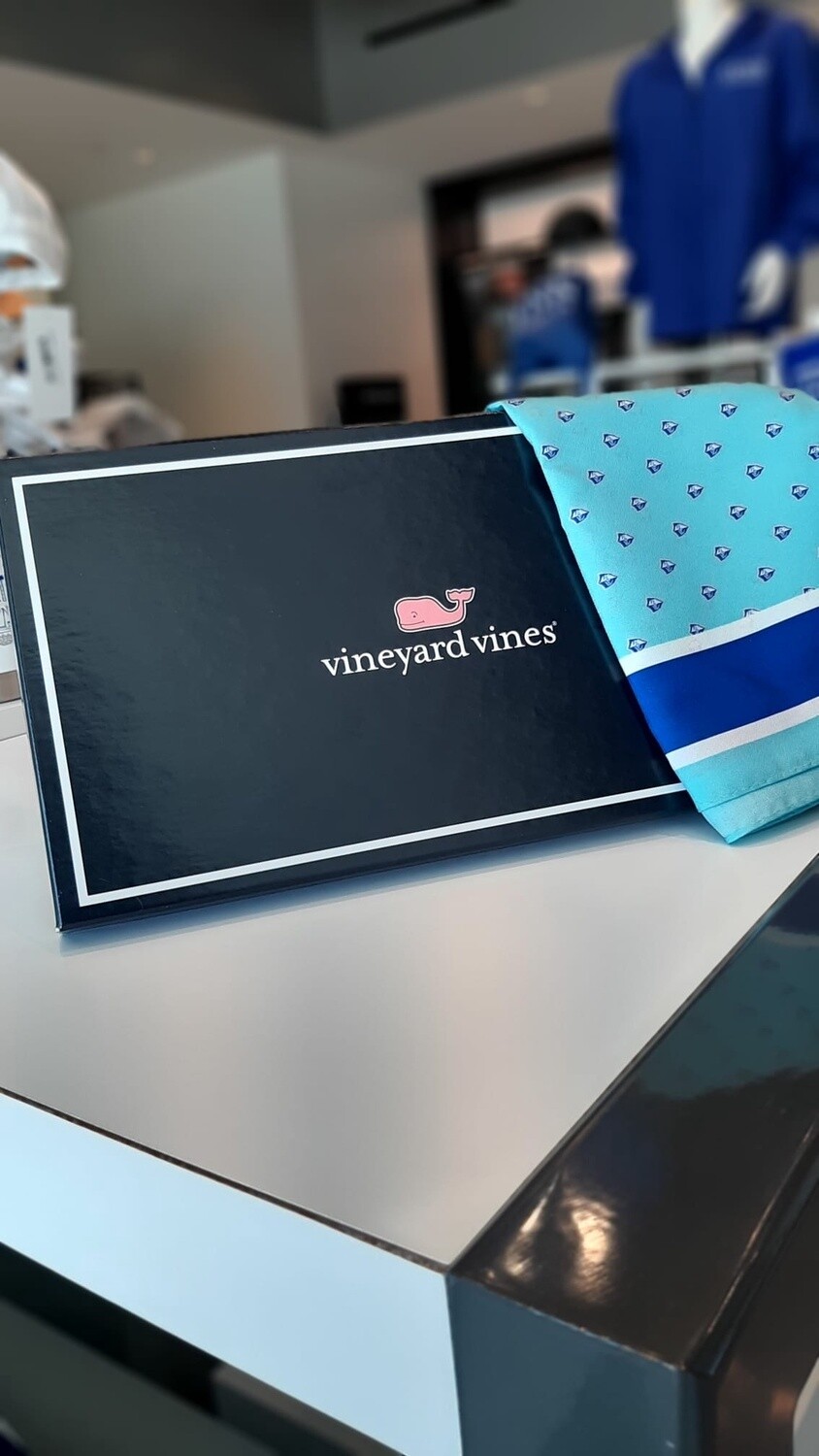 royal blue, white, light blue and pink scarf, with whales all over.