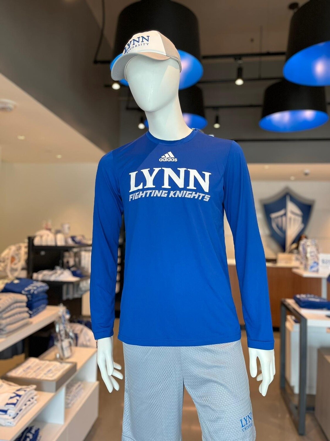 Royal blue long-sleeve dri-fit shirt with white text saying &quot;Lynn fighting knights.&quot;