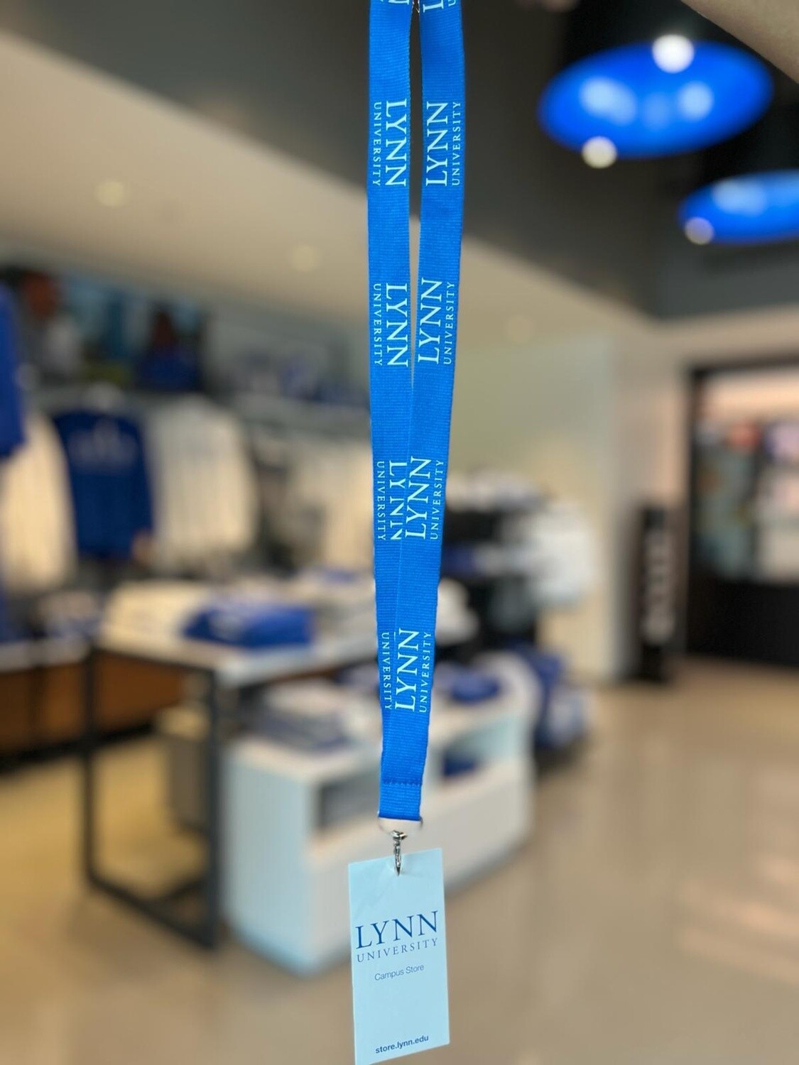 Blue lanyard with white text saying &quot;Lynn.&quot;