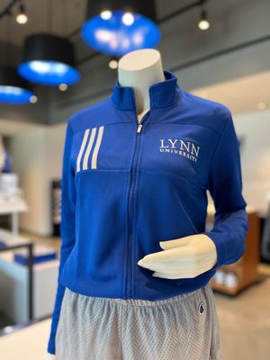 choice between royal blue and gray full-zip jacket with three stripes on the right side of the chest and text on the left side saying &quot;Lynn University.&quot;