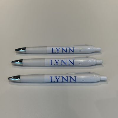 white and silver clickable pen with blue lettering saying &quot;Lynn.&quot;