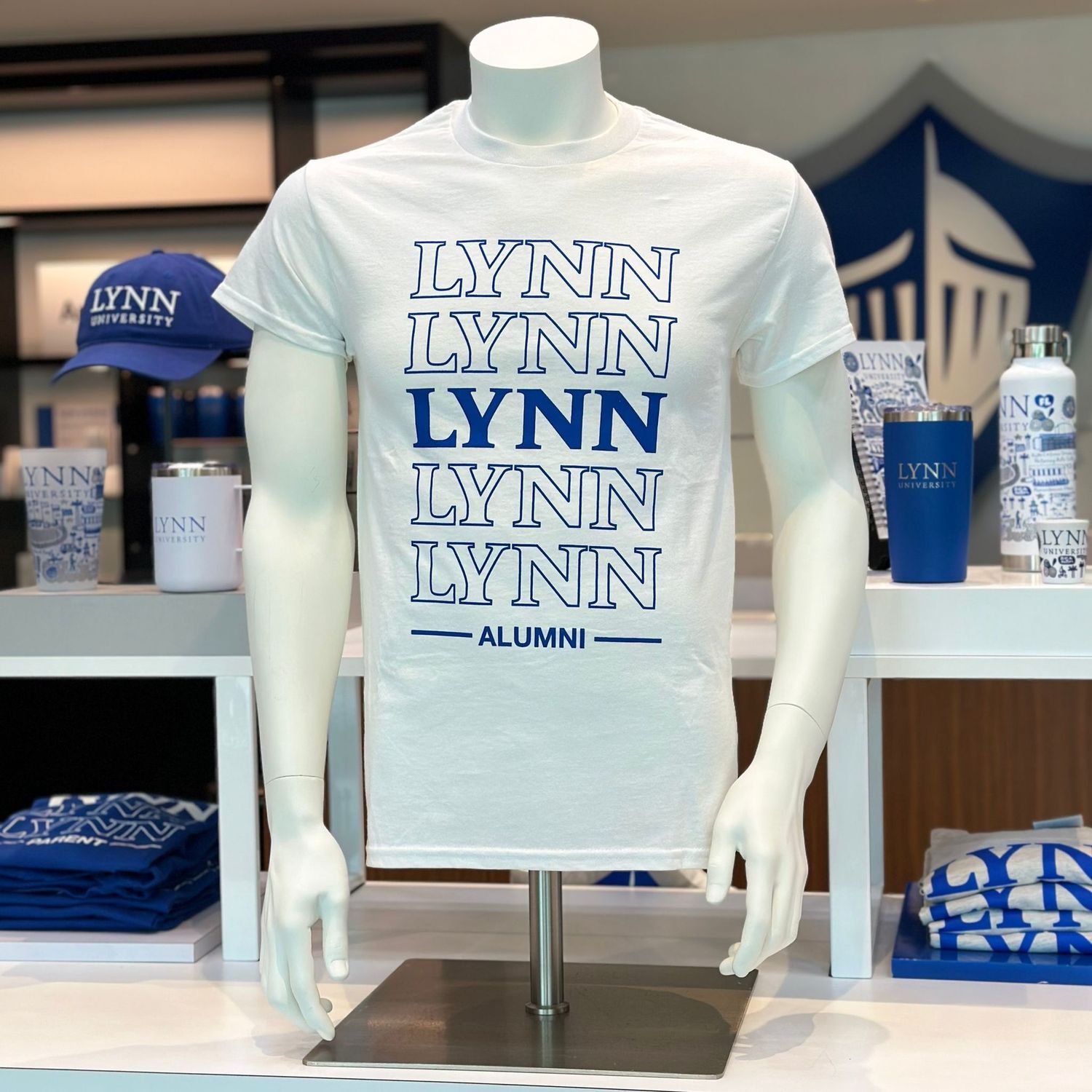 White short-sleeve t-shirt that says &quot;Lynn Alumni&quot; in royal blue.