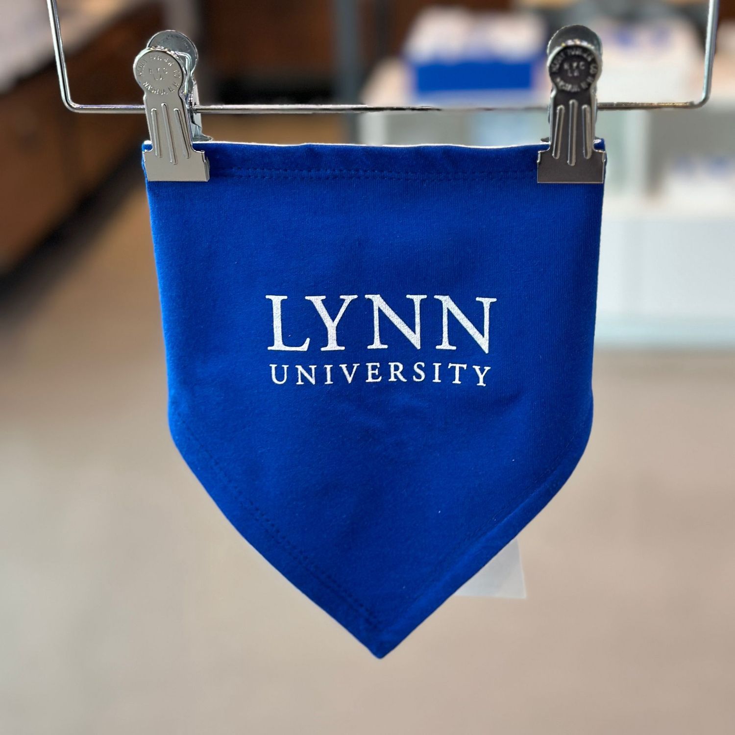 Royal blue baby bib with white text on the front saying &quot;Lynn University.&quot;