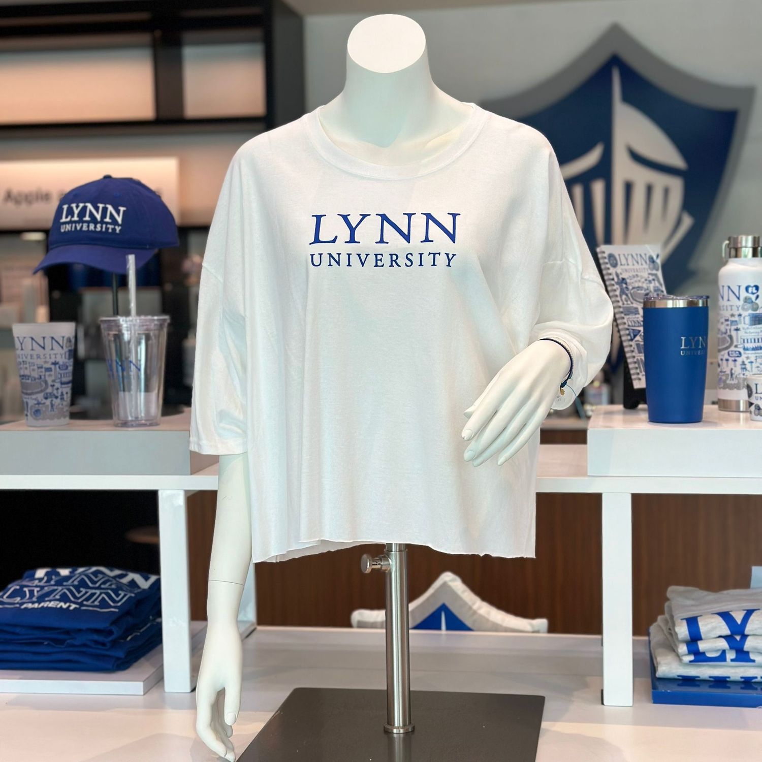 white boyfriend crop tee with blue lettering on the front saying &quot;Lynn University.&quot;