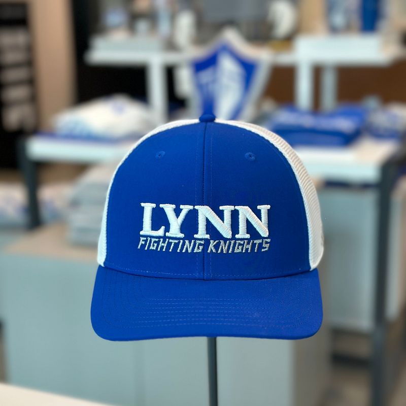 Royal blue and white hat with text on the front saying &quot;Lynn fighting knights.&quot;