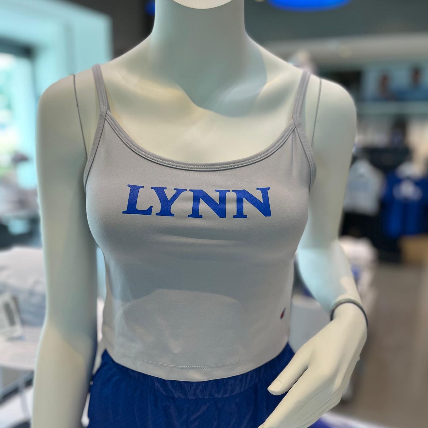 gray cropped tank top with blue lettering on the front saying &quot;Lynn&quot;
