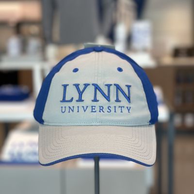 choice between gray/blue and white/gray dri-fit hat, with text saying &quot;Lynn University.&quot;