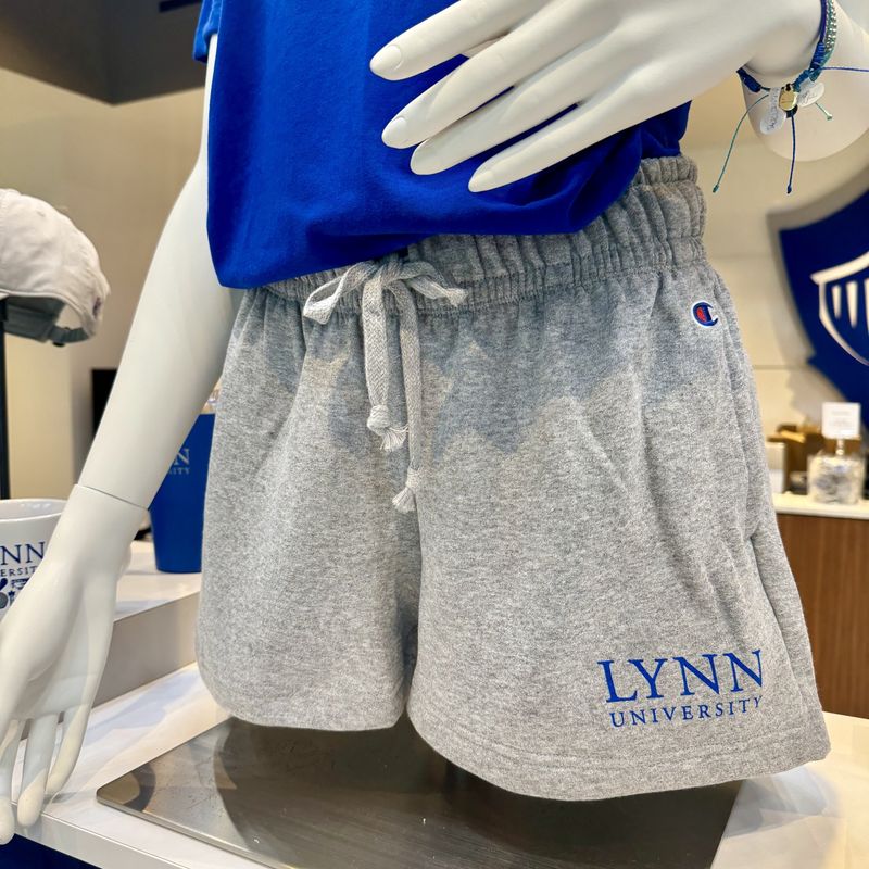Gray women&#39;s shorts with white tightening strong and blue lettering on the left side saying &quot;Lynn University.&quot;