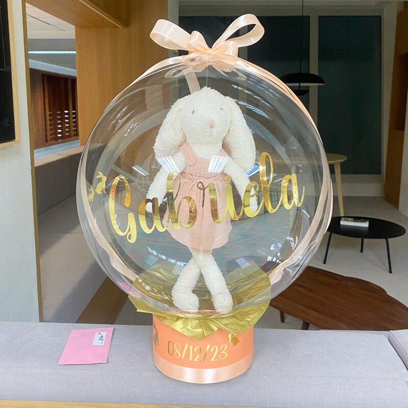 Caja burbuja y peluche