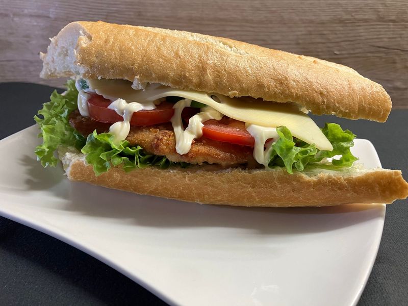 Baguettestange mit Schniztel - Schwein Baguettestange mit Schniztel - Schwein