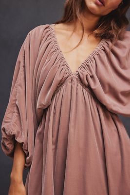 The Portia Velvet Mini Dress by Free People is a luxurious and romantic piece made from soft, plush velvet fabric. Featuring a flattering mini length, it has a v-neckline and puffy sleeve design, creating an elegant and feminine silhouette.