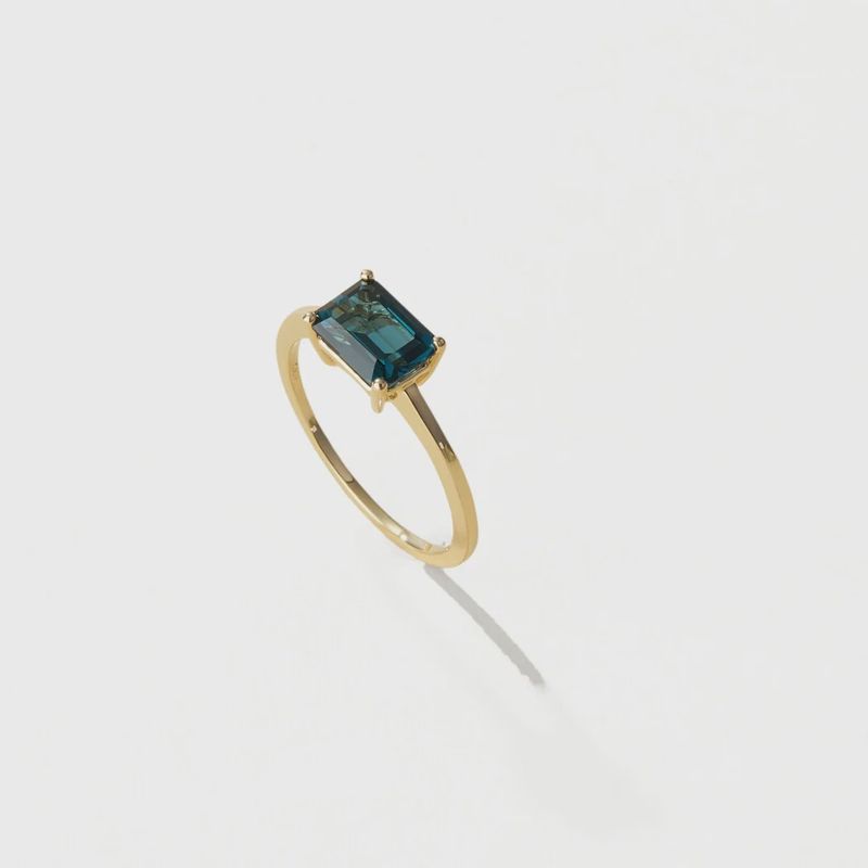 The Pleasant Bay London Blue Topaz Ring by Cove Fine Jewelry is a stunning piece featuring a vibrant London blue topaz gemstone. 
