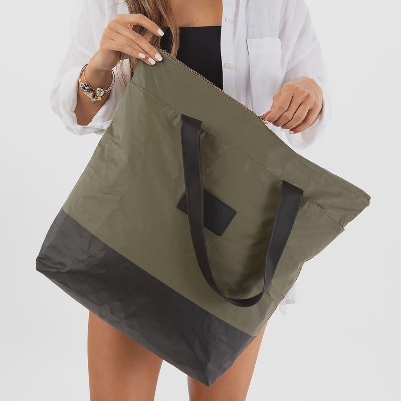 The bag is made from durable materials and offers ample space for essentials, with a spacious main compartment and sturdy handles for easy carrying. 